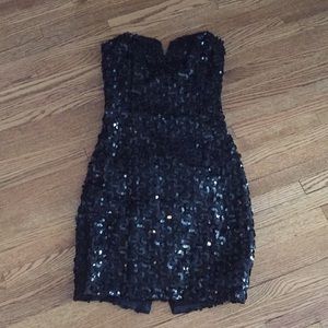 Strapless sequined little black dress